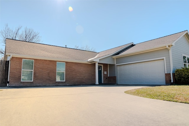 single story home featuring a garage