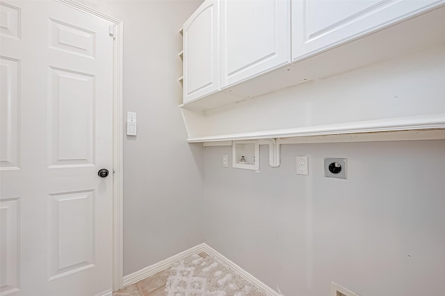 laundry room featuring cabinets, washer hookup, light tile patterned floors, and electric dryer hookup