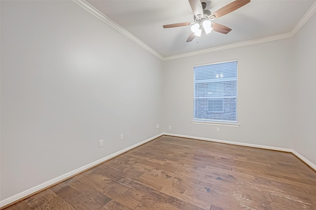 empty room featuring hardwood / wood-style flooring, ceiling fan, and crown molding