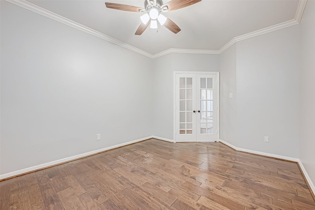 spare room with ornamental molding, french doors, ceiling fan, and light wood-type flooring