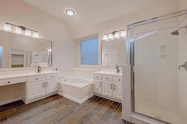 bathroom featuring plus walk in shower, lofted ceiling, and vanity