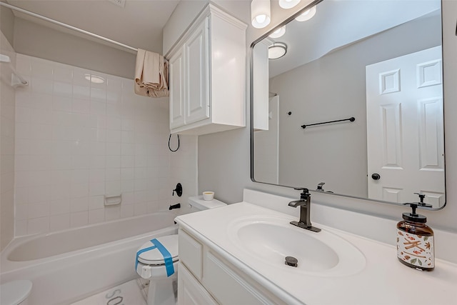 full bathroom featuring vanity, toilet, and tiled shower / bath combo