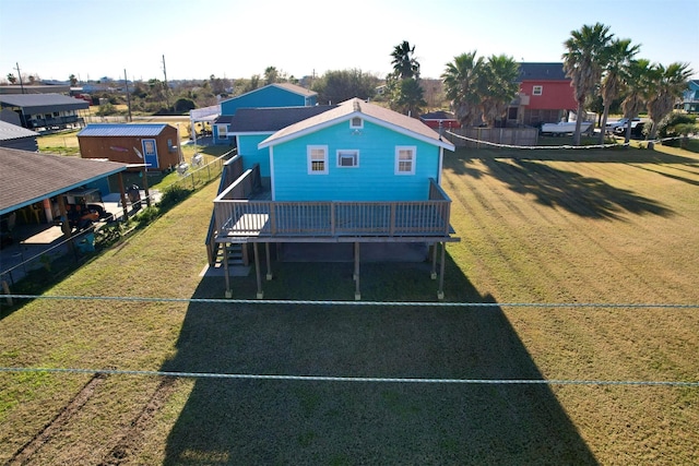 birds eye view of property featuring a yard and a deck