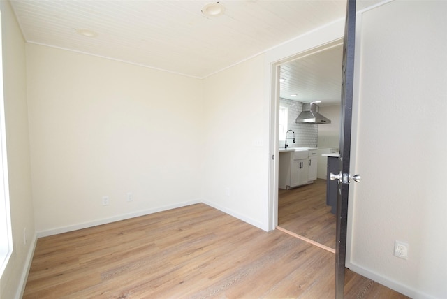 unfurnished room with light wood-type flooring