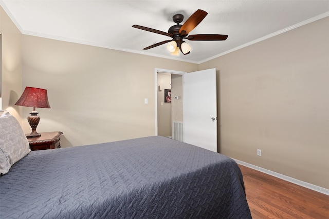 bedroom featuring crown molding, ceiling fan, and wood-type flooring