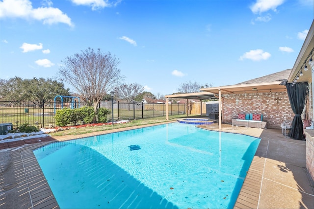 view of swimming pool with an in ground hot tub and a patio area