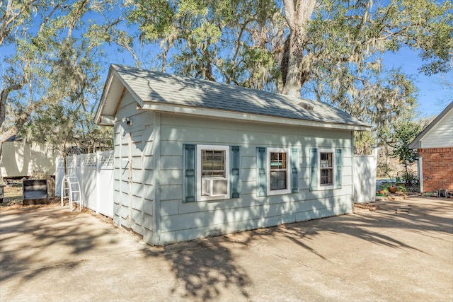 view of front of home featuring an outbuilding