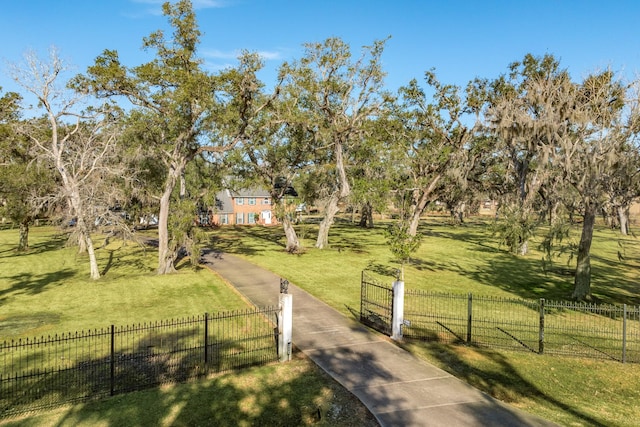 view of home's community featuring a yard and a rural view