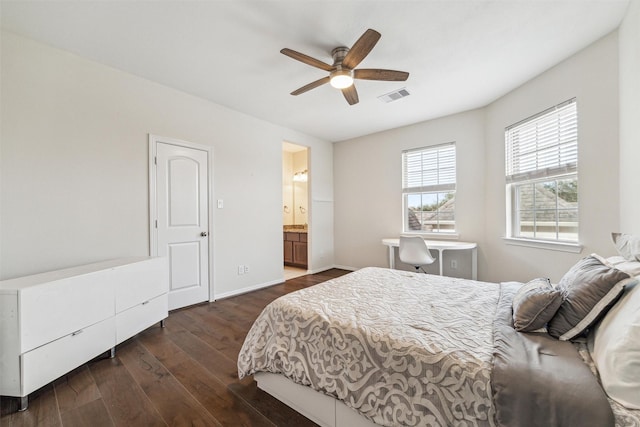 bedroom with ceiling fan, ensuite bathroom, and dark hardwood / wood-style flooring