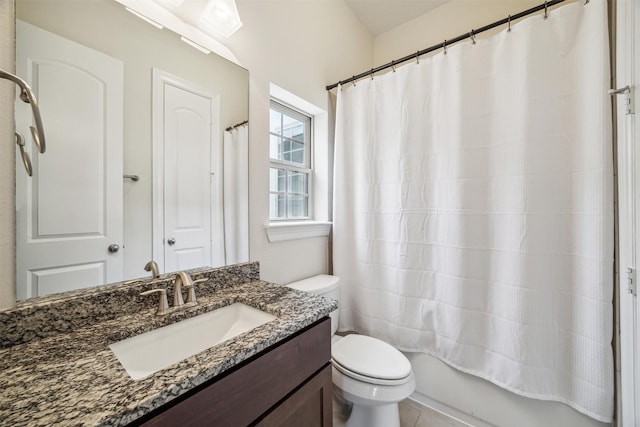 full bathroom with vanity, shower / tub combo, and toilet