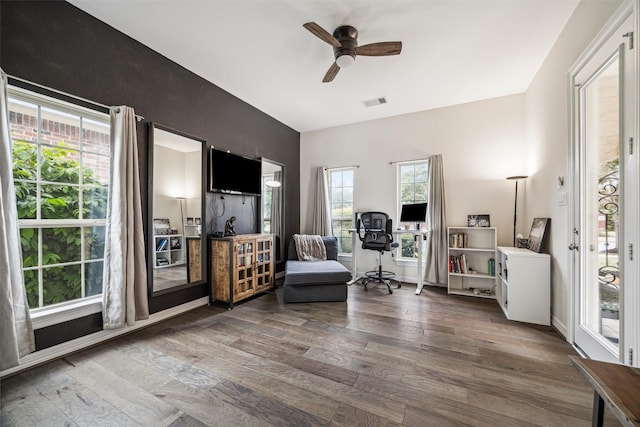 sitting room with ceiling fan and dark hardwood / wood-style flooring