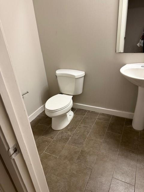 bathroom featuring sink and toilet