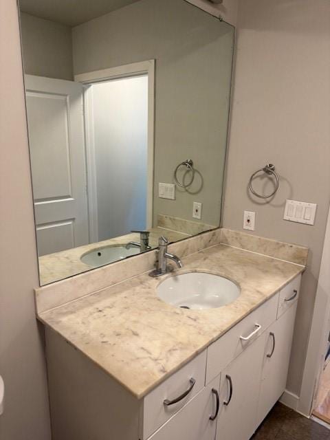 bathroom with vanity and tile patterned flooring