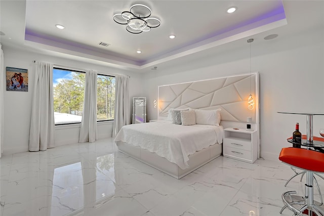 bedroom with a raised ceiling