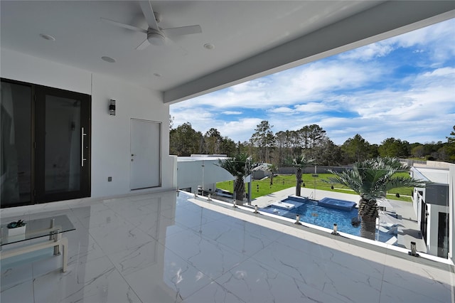 view of patio / terrace with ceiling fan and a fenced in pool