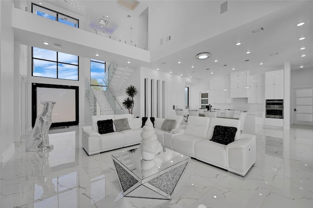 living room featuring a high ceiling