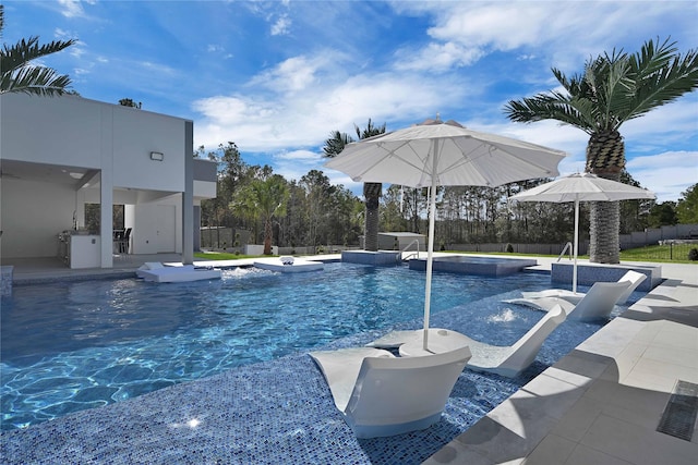 view of pool with pool water feature and a patio area