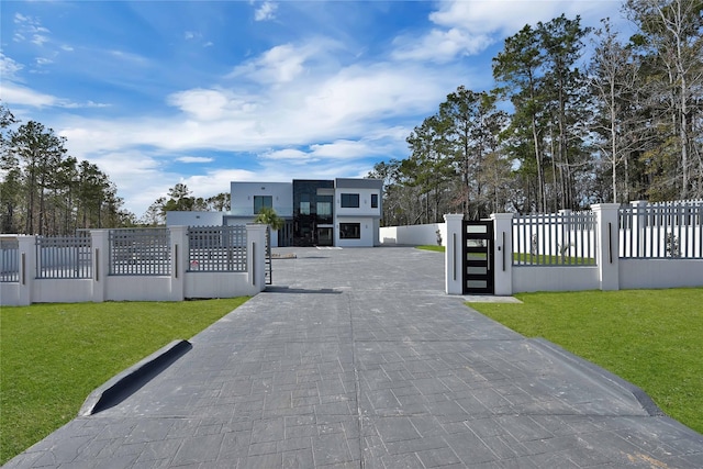 view of gate featuring a yard