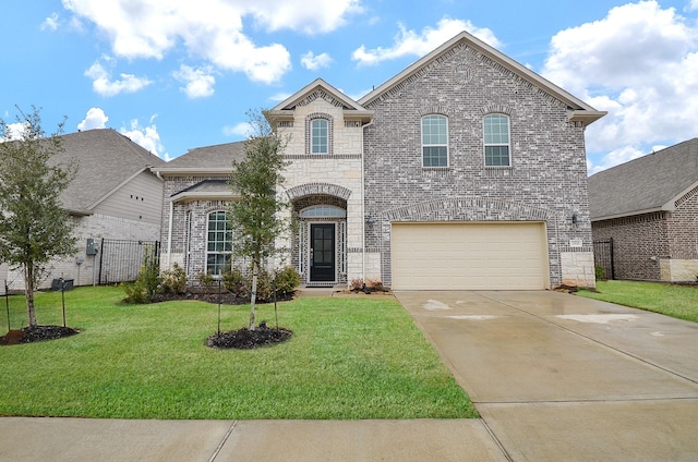 french country home featuring a garage, brick siding, concrete driveway, stone siding, and a front yard