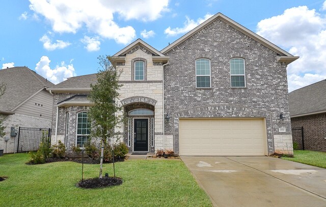 view of front facade featuring a garage and a front lawn