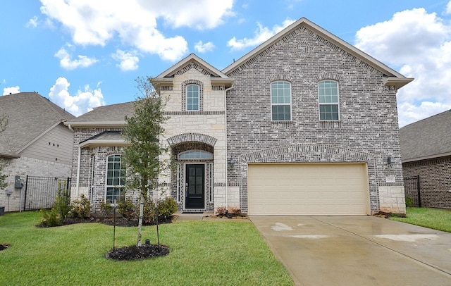 french country style house featuring brick siding, driveway, and a front lawn