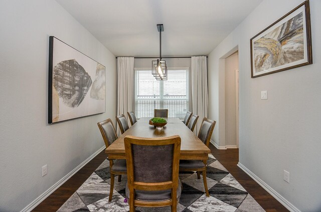 dining area with dark hardwood / wood-style floors