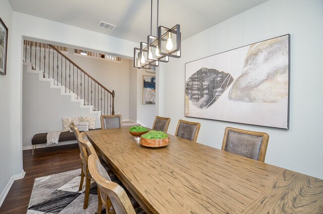 dining space with dark wood-type flooring