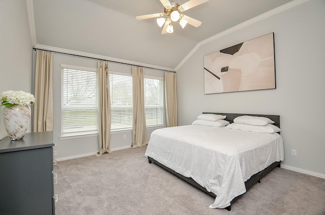 bedroom with crown molding, vaulted ceiling, and light carpet