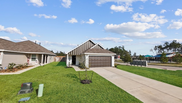 view of front of property featuring a garage and a front lawn