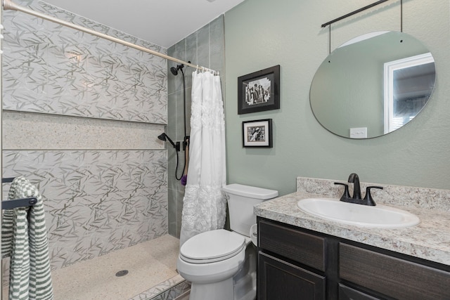 bathroom featuring vanity, a shower with curtain, and toilet