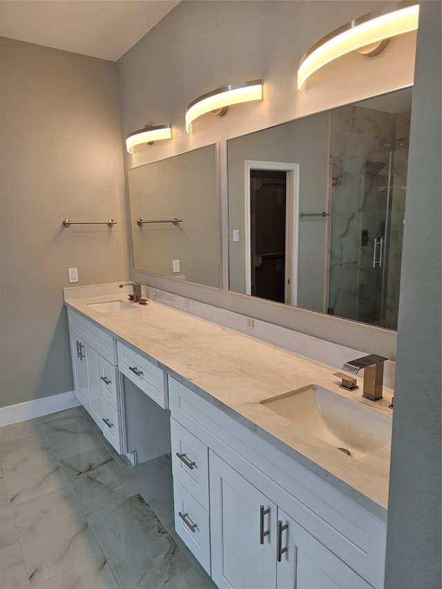 bathroom featuring vanity and an enclosed shower