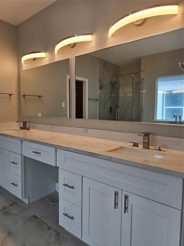 bathroom with walk in shower and vanity