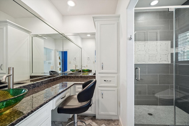 bathroom with vanity and walk in shower