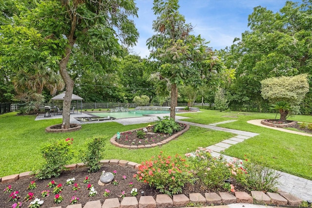 surrounding community with a gazebo, a pool, and a lawn