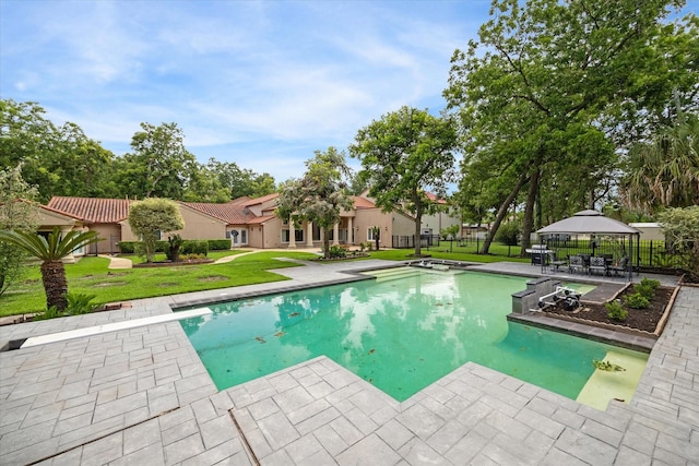 view of pool with a gazebo, a patio, and a lawn