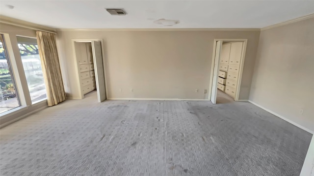 carpeted empty room featuring ornamental molding