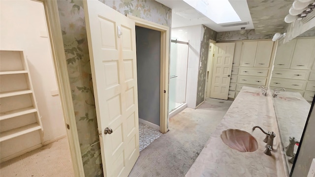 bathroom with a skylight