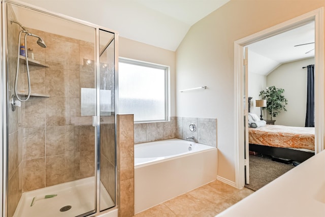 bathroom with lofted ceiling, tile patterned flooring, and independent shower and bath