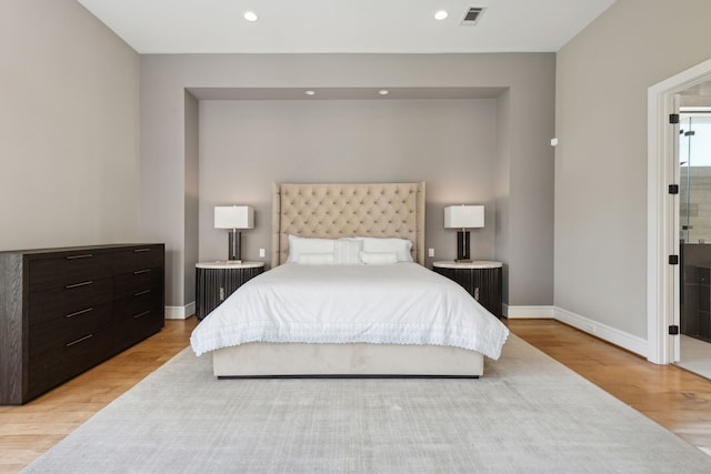 bedroom with light hardwood / wood-style flooring