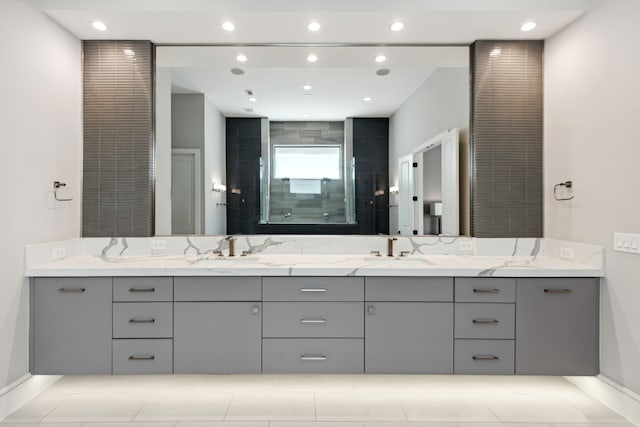 bathroom featuring vanity and tiled shower