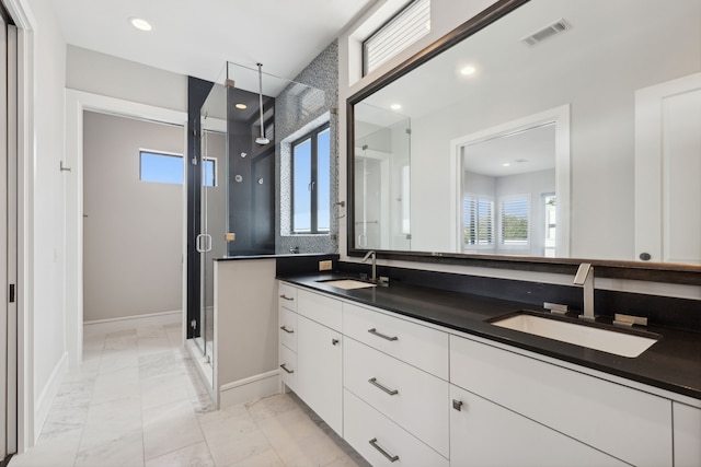 bathroom with vanity and an enclosed shower