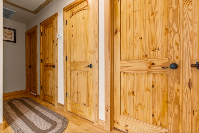 hallway featuring wood-type flooring