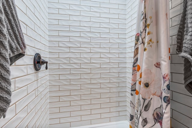 bathroom with a shower with curtain