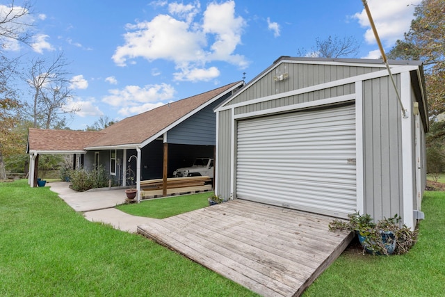 garage featuring a lawn