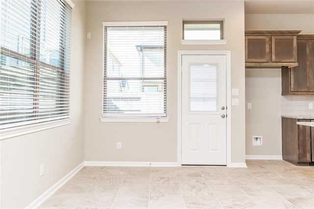 doorway to outside featuring plenty of natural light