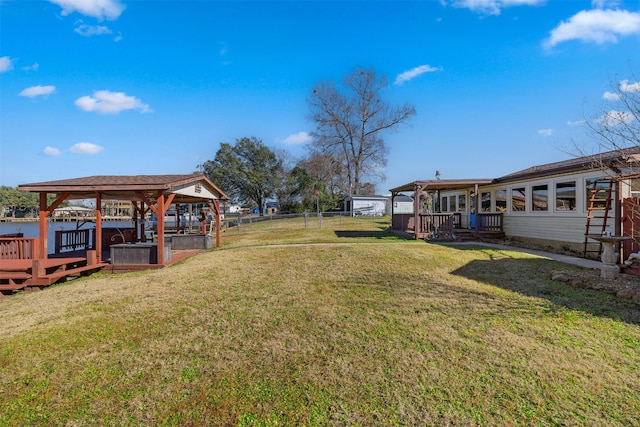 view of yard featuring a wooden deck and a gazebo