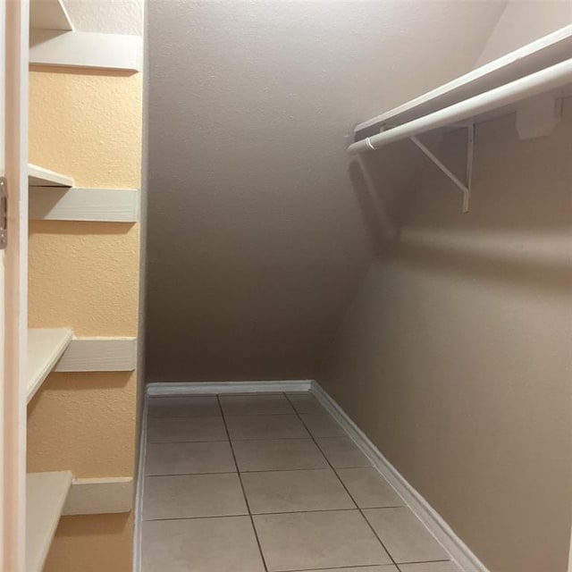 spacious closet with tile patterned flooring