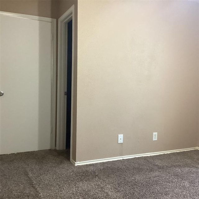 empty room with carpet flooring