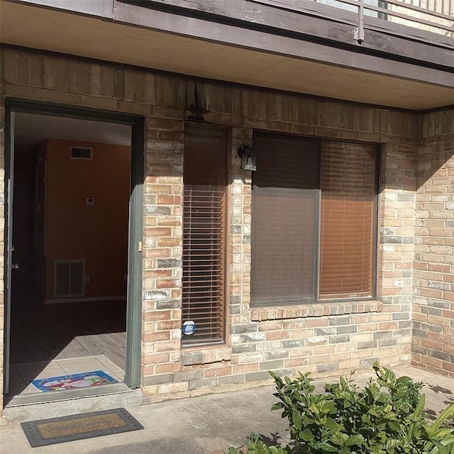 doorway to property with a balcony