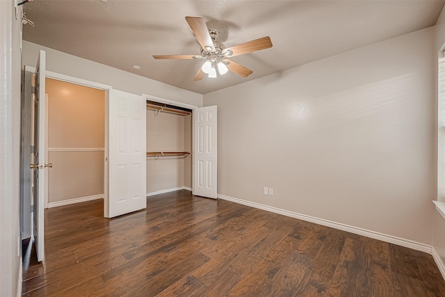 unfurnished bedroom featuring dark hardwood / wood-style flooring and ceiling fan